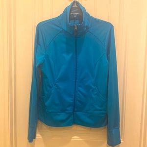 Bright blue jacket. Active wear. With pockets.
